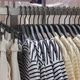 Clothes of Various Sizes Hang on a Hanger in the Store Hung By Color for the Convenience of - VideoHive Item for Sale