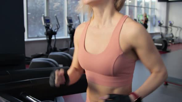 Young woman training on treadmill