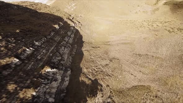 FPV Drone Footage Smooth Stabilized Fly Along Mountain Rocky Hill Around Highland Lake