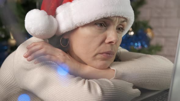 Alone Woman in Santa Hat Having Video alt