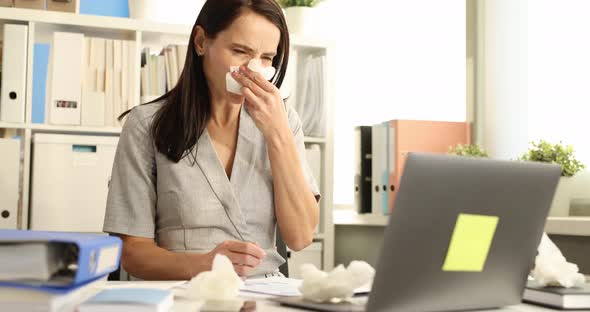 Woman Having Cold Sneezing with Runny Nose in Workplace Slow Motion  Movie alt