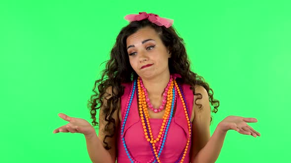 Upset Girl Shrugs and Shakes Her Head Negatively alt