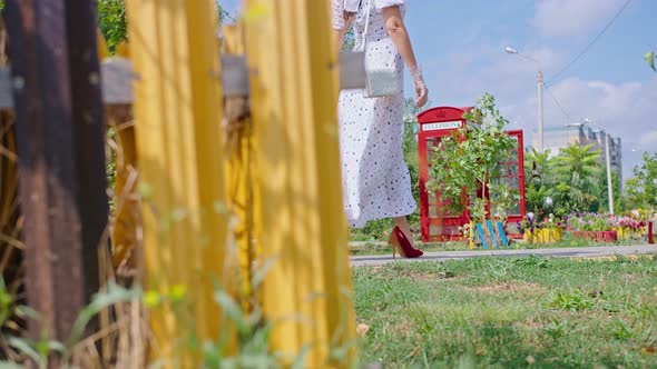 Young Happy Woman in White Dress Walks Down the Alley Pinup alt