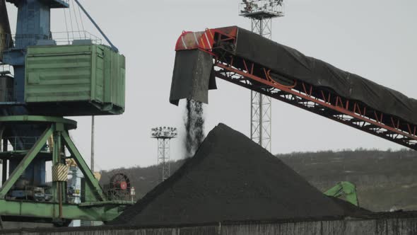 The Conveyor Belt Delivers Coal to Port Crane for Reloading