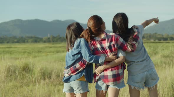 Group of young Asian women looks to view the mountain and having fun together a summer traveling.