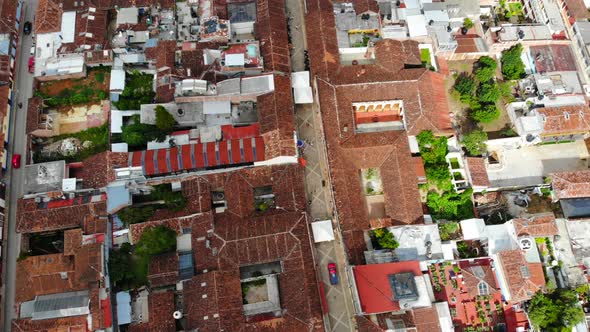 4k walking street in San Cristóbal de las Casas, Chiapas during elections, with white voting tents alt