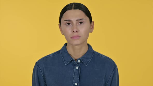 Upset Latin Woman Feeling Annoyed Yellow Background alt