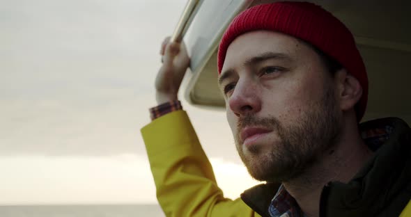 Portrait of a Sailor in a Yellow Raincoat Sailing on a Ship