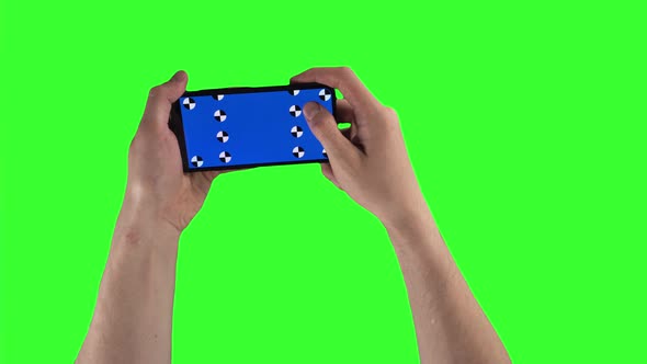 Man is Holding Smartphone By Two Hands and Swiping Up on Display with Tracking Points on Greenscreen alt