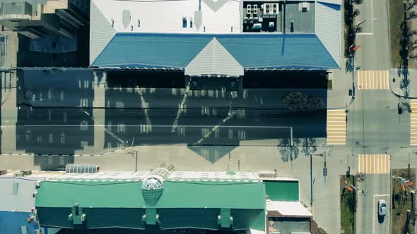 Cityscape with Few People and Vehicle in the Streets alt