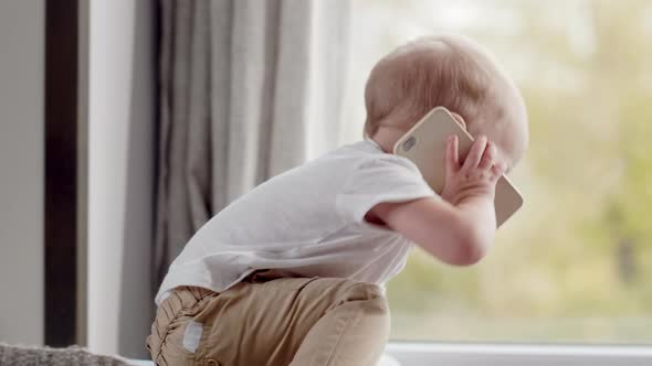 Lovely Baby Boy Calling on Phone