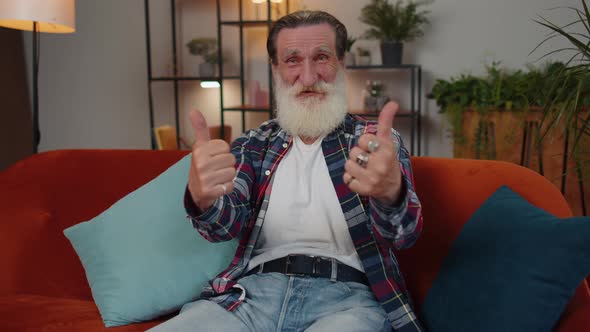 Happy Senior Old Grandfather Man Looking Approvingly at Camera Showing Thumbs Up Like Positive Sign alt