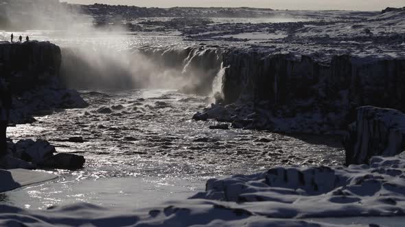 Selfoss Long Shot with Tourists Silhouette on Winter