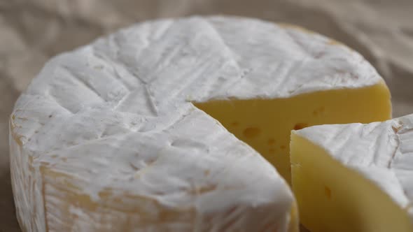Rotating Camembert cream cheese, close-up, dairy product concept alt