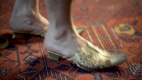 Foot tapping in beautiful women’s Moroccan decorative bridal shoes. alt