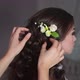 The Stylist Adorns the Girl&#39;s Hair with Delicate Flowers - VideoHive Item for Sale