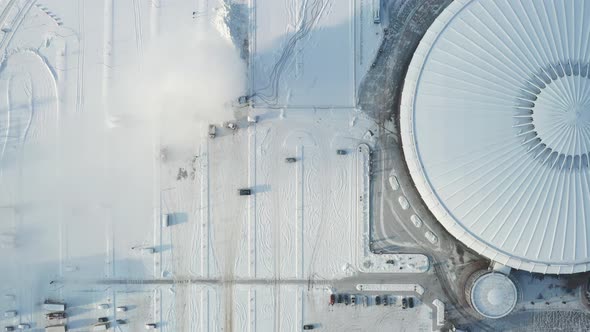 Top view in winter of a modern sports complex with parking in Minsk. Belarus alt