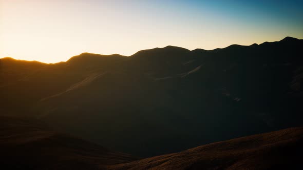 Hills with Rocks at Sunset alt