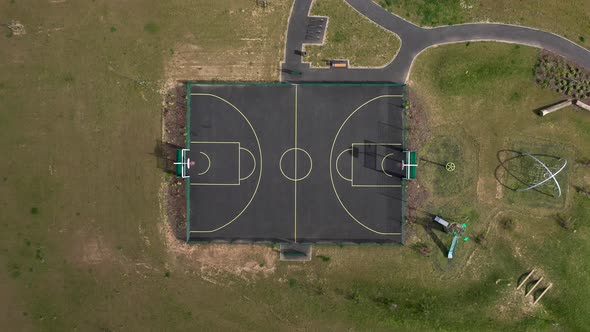Aerial view of empty basketball playground court in a park