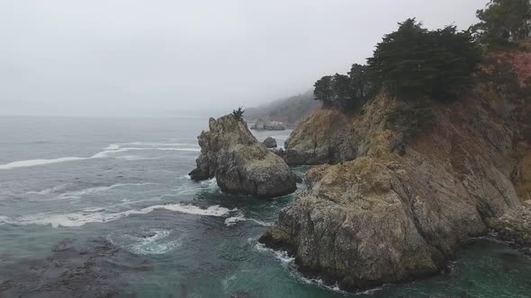 4K aerial view of Big Sur shore and Pacific Ocean. PCH California, USA alt
