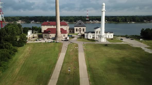 4k aerial view of drone flying in toward the historic Louisville Water Tower on summer day