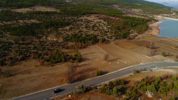 View Of Autumn Road Car And Lake alt