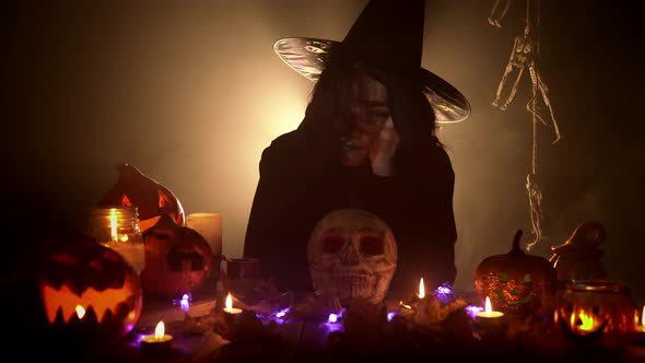 The Girl Holds Her Cheek with Her Arm and Tries to Blow the Hair From Face alt