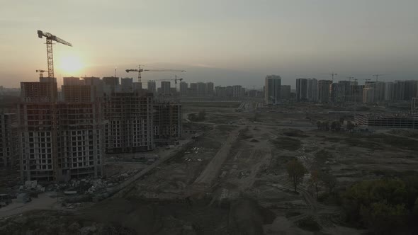Construction site of a modern city block. High-rise buildings under construction.