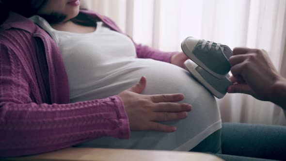 Pregnant Couple Feels Love and Relax at Home alt