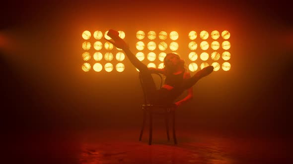Girl Showing Erotic Movements Sitting on Club Chair alt