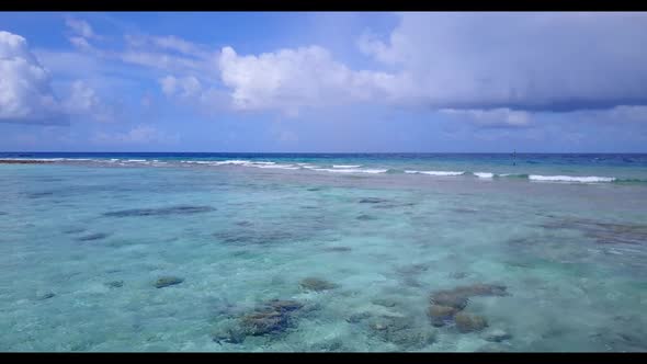 Aerial drone shot abstract of paradise coastline beach trip by blue ocean with white sand background alt