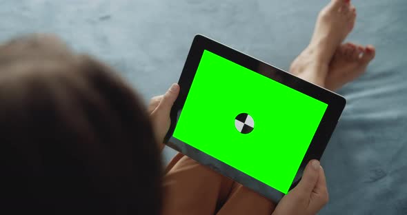 Woman Holding Greenscreen Tablet