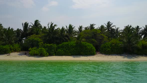 Wide angle texture of tropical island beach break by lagoon and sand background in sunlight alt