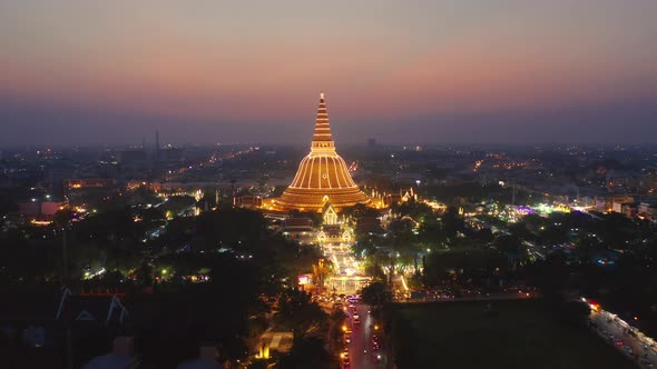 Aerial top view of Phra Pathommachedi temple at night. alt