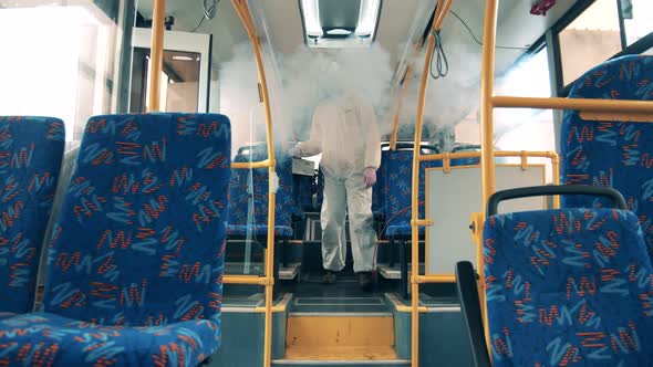 Fumigation Machine Is Being Used To Sterilize the Bus Interior alt