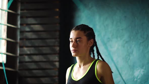 Athletic Woman Jumps on Skipping Rope alt