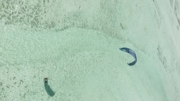 Zanzibar Tanzania  Vertical Video Kitesurfing Near the Shore of Ocean Slow Motion alt