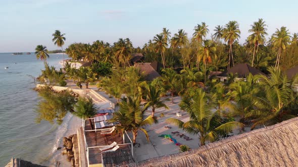 Paradise Coast Resort with Palm Trees and Hotels By Ocean Zanzibar Aerial View alt