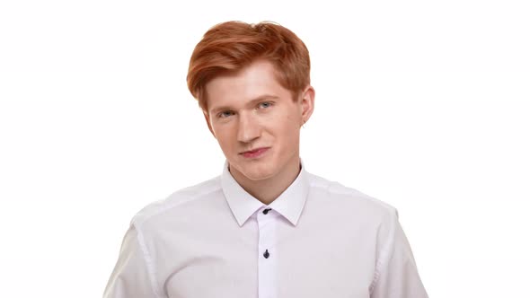 Handsome Young Caucasian Man with Red Hair Seductively Looking at Camera Flirting on White alt