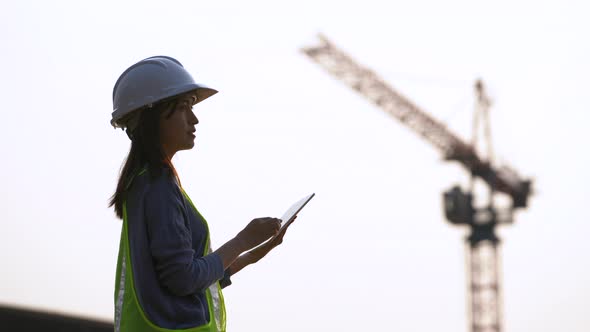 Female civil Engineering working with tablet on construction site