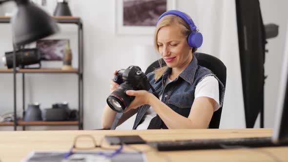 Female Photographer Reviewing Pictures alt