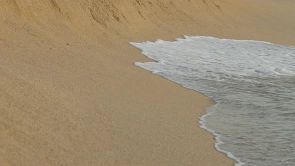 View of Beautiful Sea Waves Break on Yellow Sand Beach alt