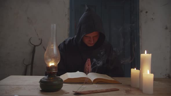 Monk with Bible Reading Prayer in Rustic House alt