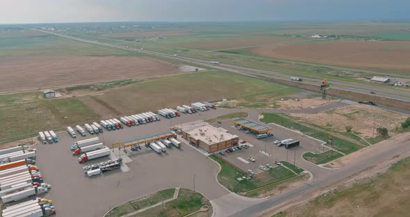Fleet of Trucks on a Refueling Car on Gas Station with Truck Stop alt