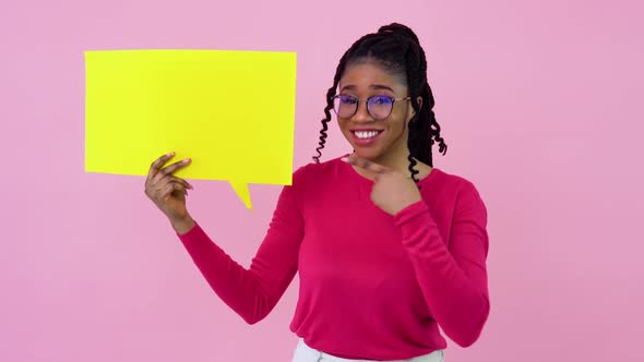 Young African American Girl in Pink Clothes Stands with Posters for Expression on a Solid Pink alt