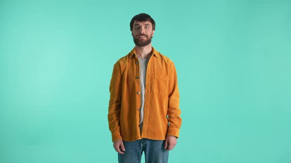 Smiling Male Inviting Viewers to Make Purchase alt