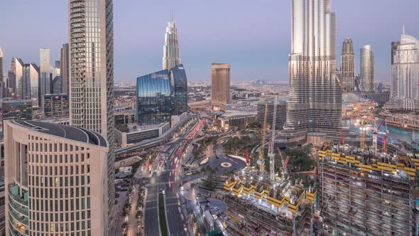Panoramic Skyline View of Dubai Downtown After Sunset with Mall Fountains and Skyscrapers Aerial Day alt