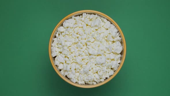 Bowl of cottage cheese rotating on a chromakey background.