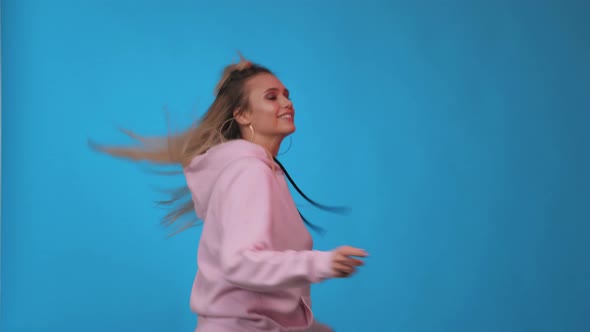 Happy girl dancing. Party, music, lifestyle, radio and disco. Dancing woman. Studio background. alt