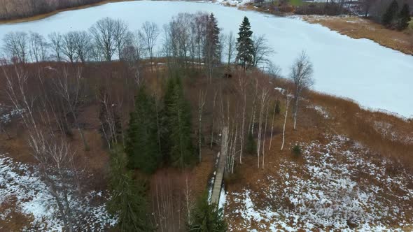 Araisi Lake Castle in Latvia Aerial Shot From Above. Historical Wooden Buildings on Small Island in alt